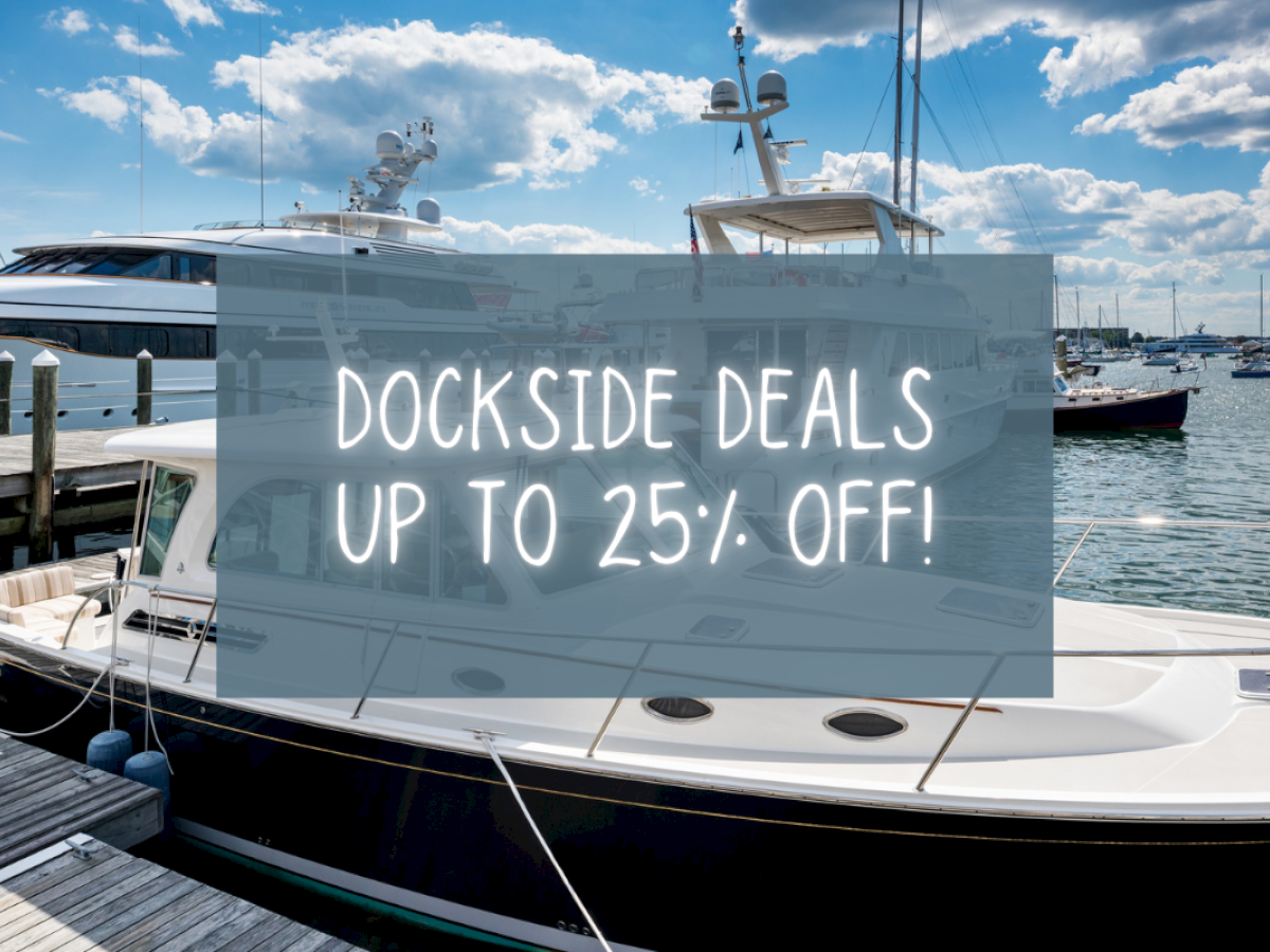 Boats docked at a marina with a sign: "DOCKSIDE DEALS UP TO 25% OFF!" overlaid on the image.