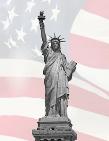 The image shows the Statue of Liberty against a background of the American flag with stars and stripes.
